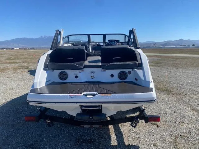 Slide: The Image of 2022 Scarab 195 ID boat on trailer, rear view, outdoors. - 6