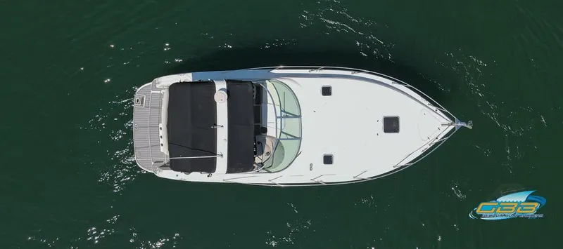 Slide: The Image of Overhead view of a 2000 Rinker 340 Express Cruiser on water. - 11