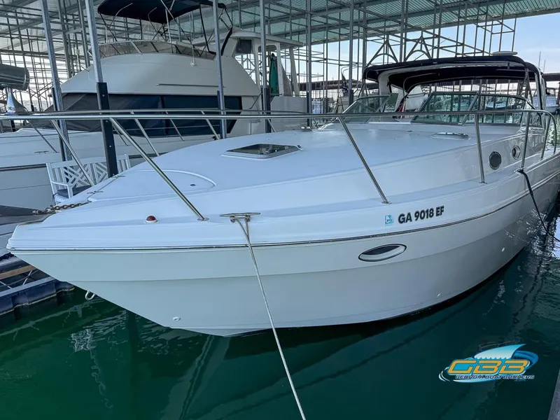 Slide: The Image of 2000 Rinker 340 Express Cruiser docked in marina, side view. - 15