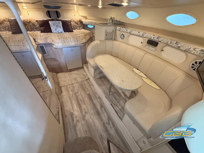 Slide: The Image of Interior of 2000 Rinker 340 Fiesta Vee yacht with cozy seating and elegant decor. - 29