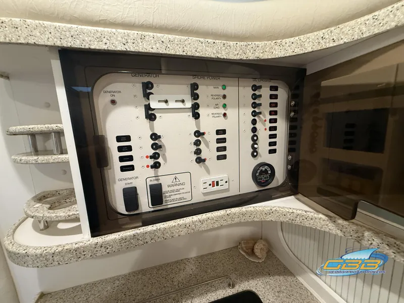 Slide: The Image of Electrical control panel on a 2000 Rinker 340 Fiesta Vee boat interior. - 34