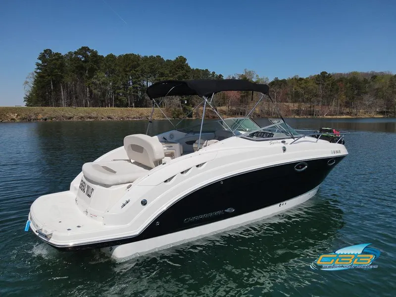Slide: The Image of 2008 Monterey 250 Cruiser boat on a calm lake with forested shoreline. - 11