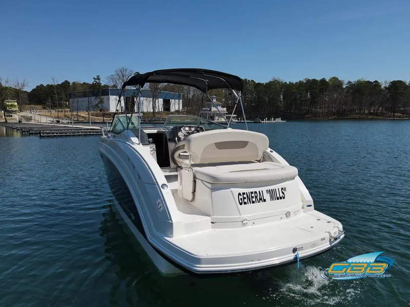 Slide: The Image of 2008 Monterey 250 Cruiser boat on a lake, rear view with "General Mills" name. - 12