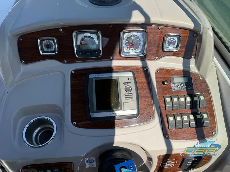 Slide: The Image of Dashboard of a 2008 Monterey 250 Cruiser boat with gauges and controls. - 32