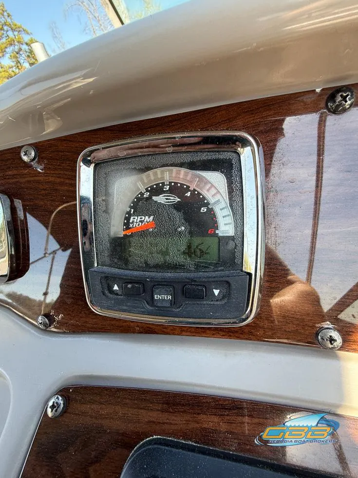 Slide: The Image of Dashboard of a 2008 Monterey 250 Cruiser boat with RPM gauge. - 33