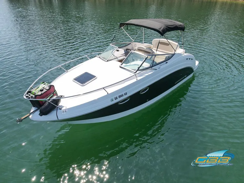 Slide: The Image of 2008 Monterey 250 Cruiser boat on calm water with canopy and sleek design. - 4