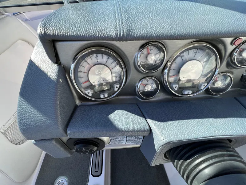 Slide: The Image of Dashboard of 2008 Nautique Super Air 210 boat with gauges and controls. - 21