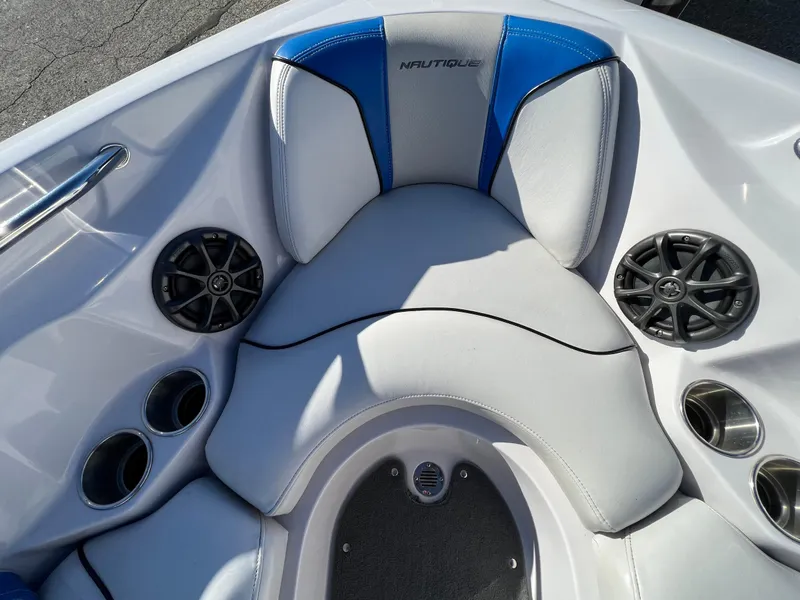 Slide: The Image of 2008 Nautique Super Air 210 boat interior with speakers and cup holders. - 32