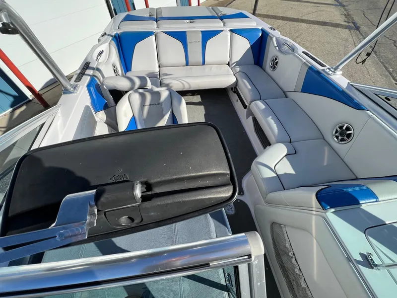 Slide: The Image of 2008 Nautique Super Air 210 boat interior with blue and white seating. - 34