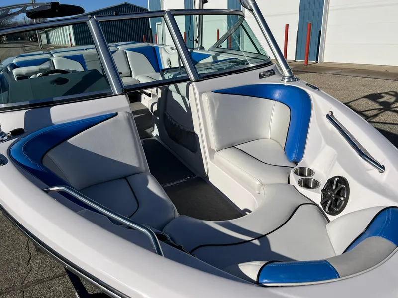 Slide: The Image of 2008 Nautique Super Air 210 boat interior with blue and white seating. - 4