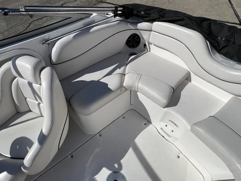 Slide: The Image of 2006 Yamaha Boats SR 210 interior with white seating and sleek design. - 18