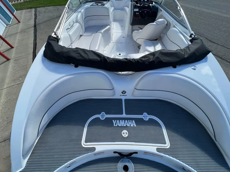 Slide: The Image of 2006 Yamaha Boats SR 210 interior, featuring white seating and sleek design. - 2