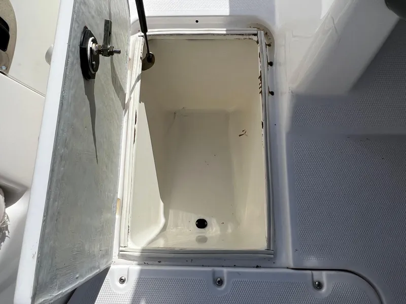 Slide: The Image of Open storage compartment on a 2006 Yamaha Boats SR 210. - 24