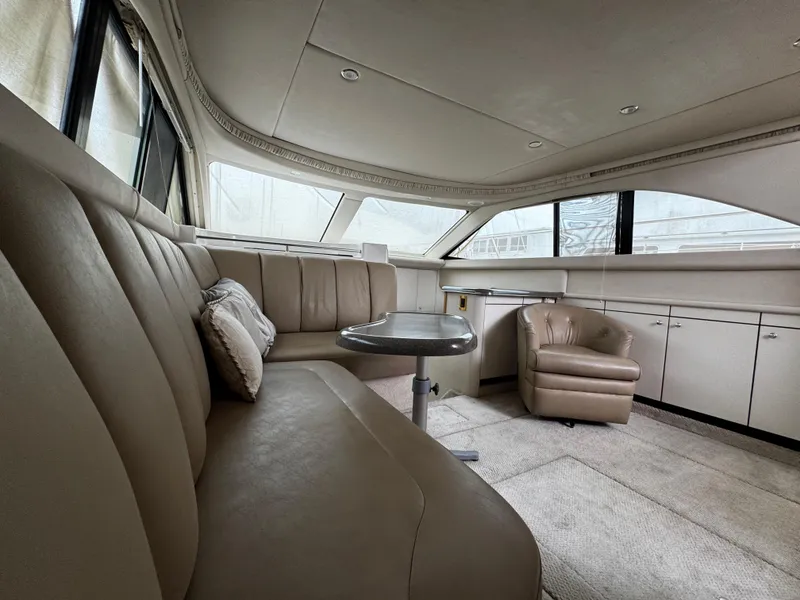 Slide: The Image of Luxurious interior of 1998 Sea Ray 370 Aft Cabin yacht with plush seating and elegant design. - 34
