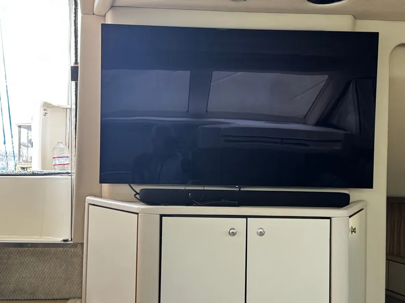 Slide: The Image of Flat-screen TV on cabinet inside 1998 Sea Ray 370 Aft Cabin yacht. - 35