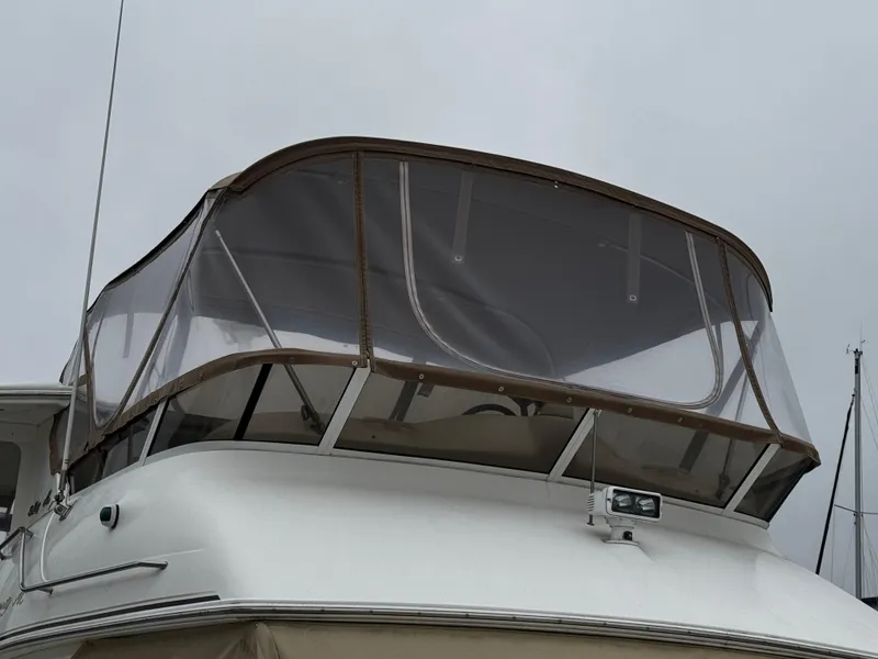 Slide: The Image of 1998 Sea Ray 370 Aft Cabin boat with enclosed flybridge, overcast sky. - 5