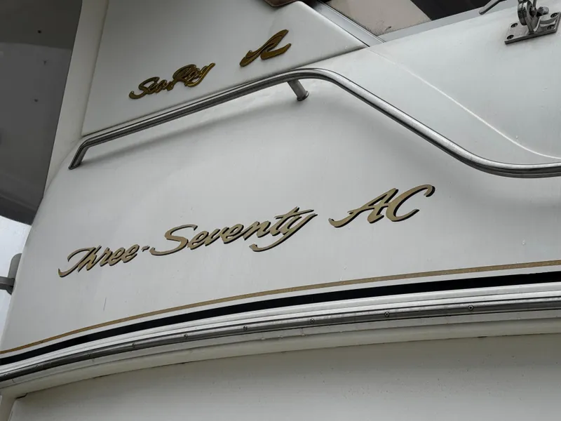 Slide: The Image of 1998 Sea Ray 370 Aft Cabin boat with "Three Seventy AC" lettering. - 7