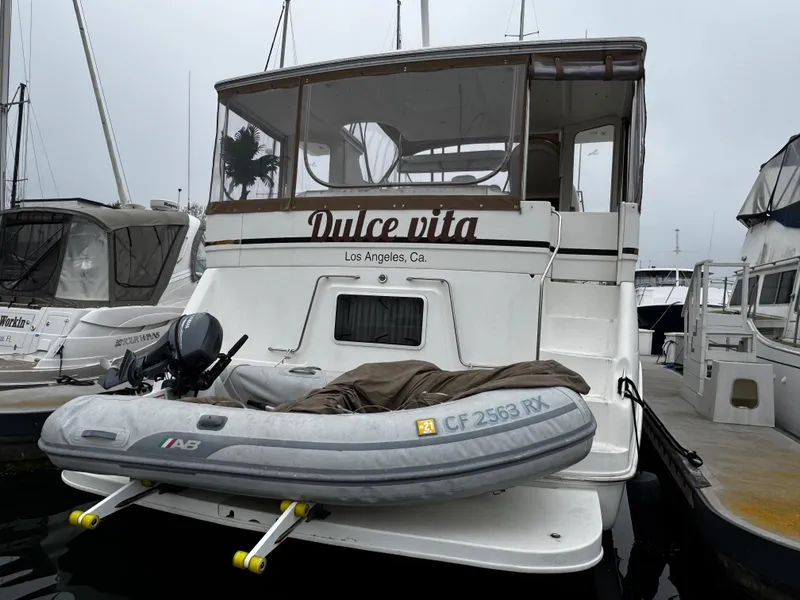 Slide: The Image of 1998 Sea Ray 370 Aft Cabin yacht with inflatable boat, docked in Los Angeles marina. - 9