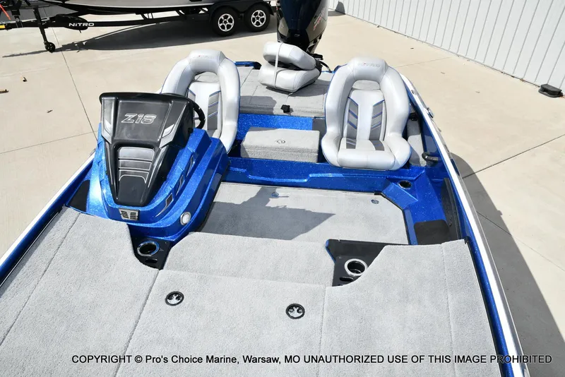 Slide: The Image of 2023 Nitro Z18 Pro boat interior with gray seating and blue accents. - 12