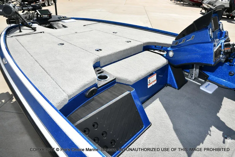 Slide: The Image of 2023 Nitro Z18 Pro boat interior with gray carpet and blue accents. - 14