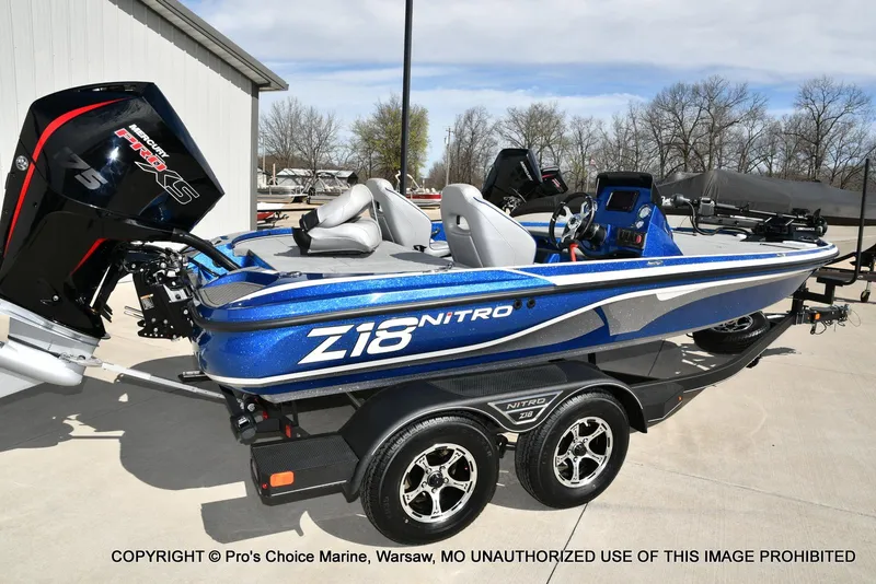 Slide: The Image of 2023 Nitro Z18 Pro boat with 175 Pro-XS engine, parked on a trailer. - 20