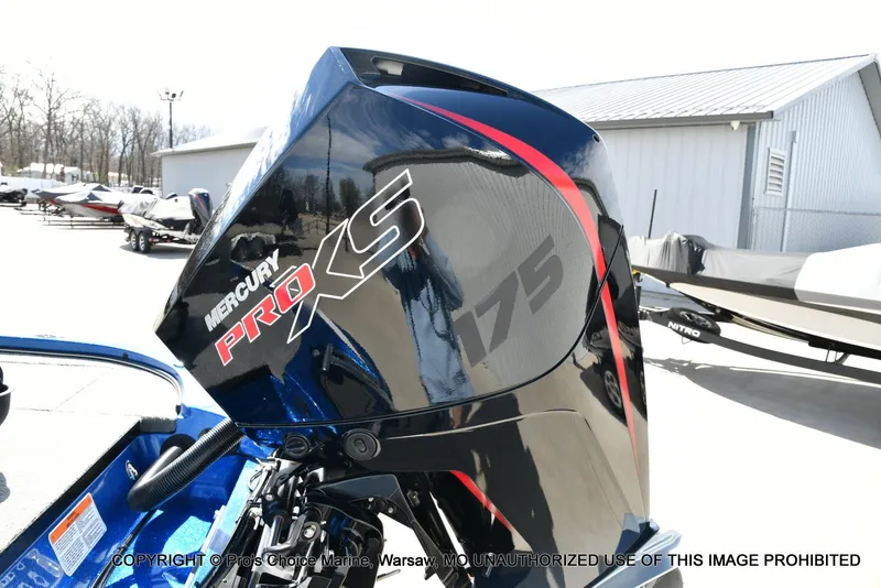 Slide: The Image of 2023 Nitro Z18 Pro boat with Mercury 175 Pro-XS engine in a marina setting. - 26