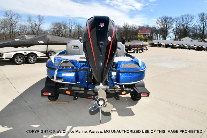 Slide: The Image of 2023 Nitro Z18 Pro boat with 175 Pro-XS engine, parked outdoors. - 27