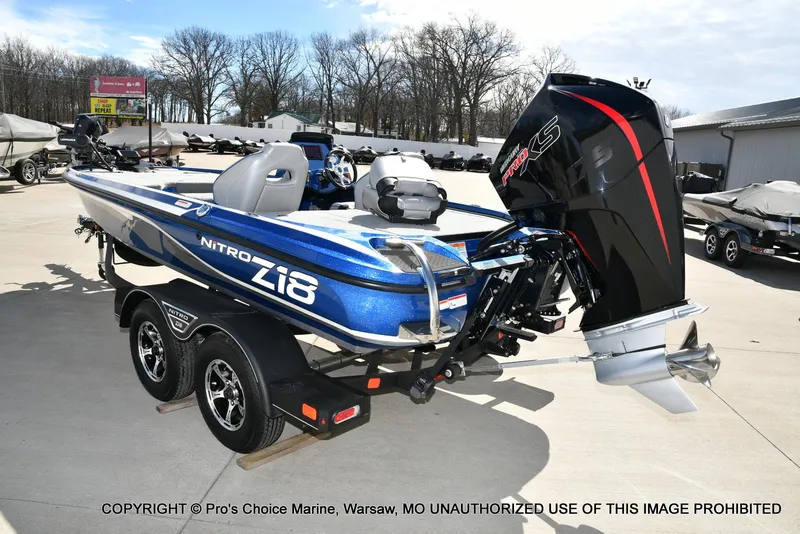 Slide: The Image of 2023 Nitro Z18 Pro boat with 175 Pro-XS engine, parked outdoors. - 28