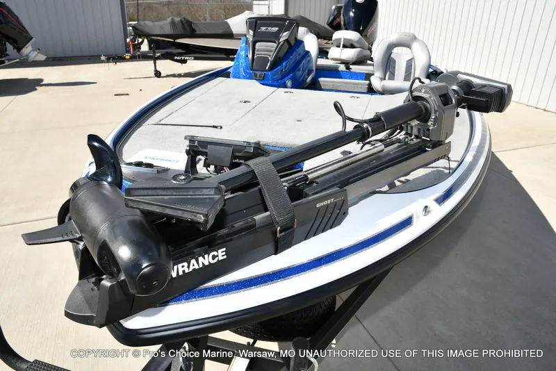 Slide: The Image of 2023 Nitro Z18 Pro boat with Lowrance Ghost trolling motor, displayed outdoors. - 32