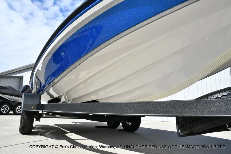 Slide: The Image of 2023 Nitro Z18 Pro boat on trailer, showcasing sleek blue and white hull design. - 35