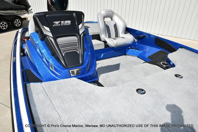 Slide: The Image of 2023 Nitro Z18 Pro boat interior with gray seating and blue accents. - 37