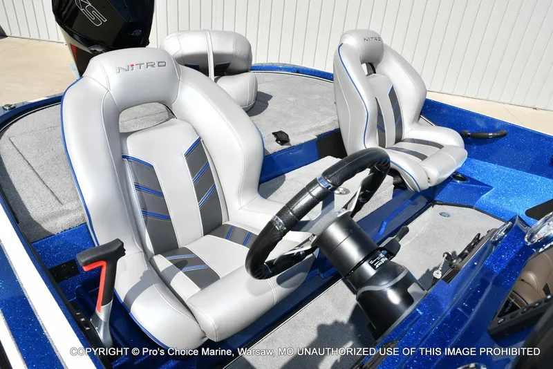 Slide: The Image of 2023 Nitro Z18 Pro boat interior with sleek seats and steering wheel. - 38