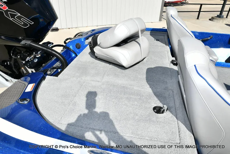 Slide: The Image of 2023 Nitro Z18 Pro boat interior with gray seating and carpeted deck. - 39