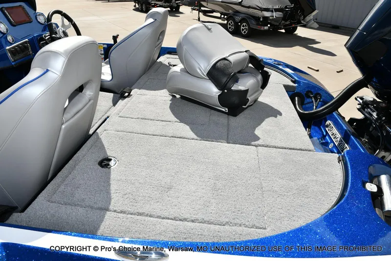 Slide: The Image of 2023 Nitro Z18 Pro boat interior with gray seating and carpeted deck. - 42