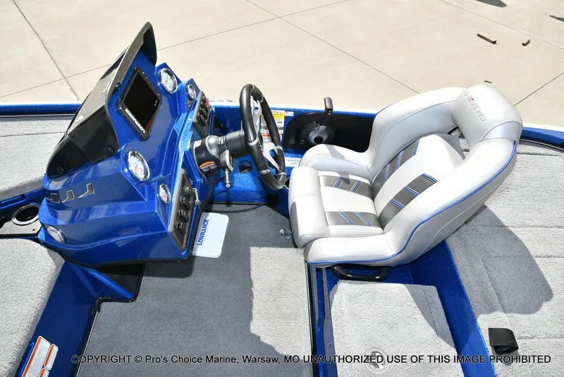 Slide: The Image of 2023 Nitro Z18 Pro boat interior with steering console and cushioned seat. - 46
