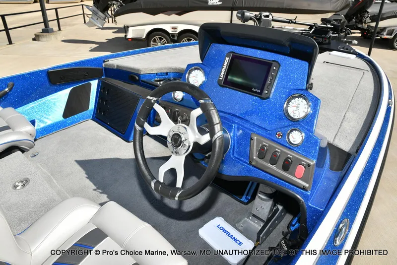 Slide: The Image of 2023 Nitro Z18 Pro boat interior with steering wheel and control panel. - 7