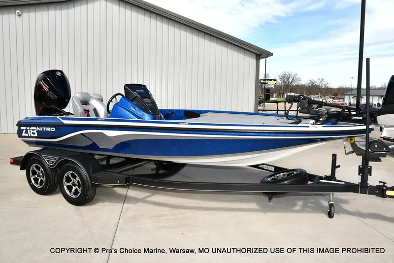 Slide: The Image of 2023 Nitro Z18 Pro boat with 175 Pro-XS engine, parked on a trailer. - 74