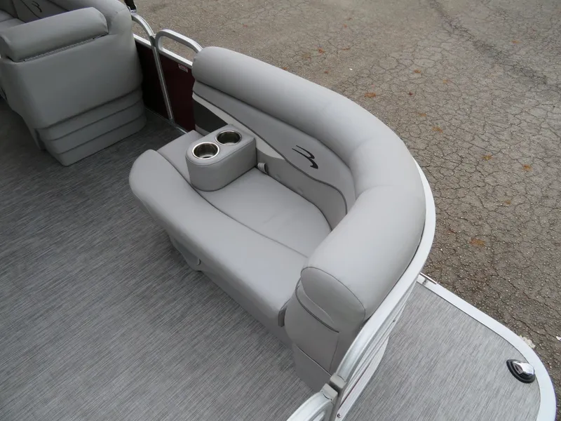 Slide: The Image of 2021 Bennington 20SLV pontoon boat with gray seating and cup holders. - 14