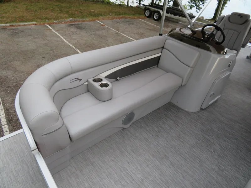 Slide: The Image of 2021 Bennington 20SLV pontoon boat interior with gray seating and cup holders. - 15