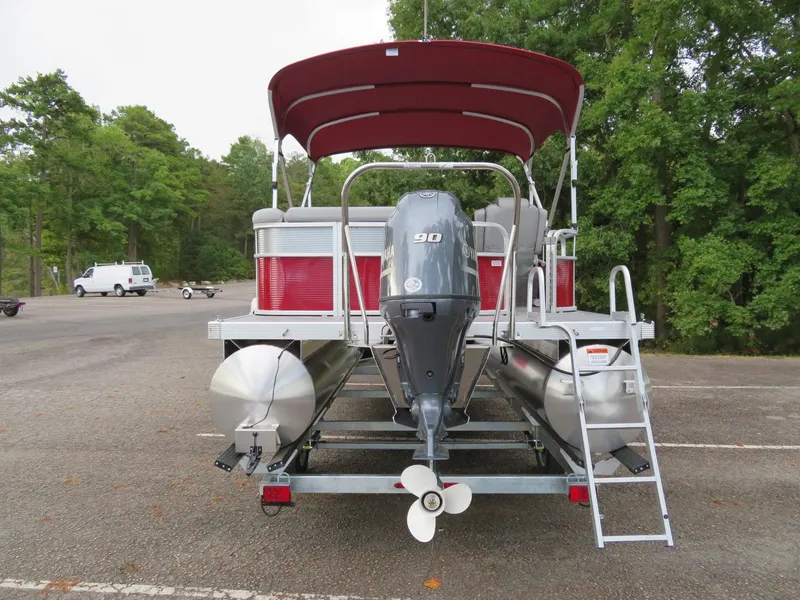 Slide: The Image of 2021 Bennington 20SLV pontoon boat with Yamaha motor in a parking lot. - 4