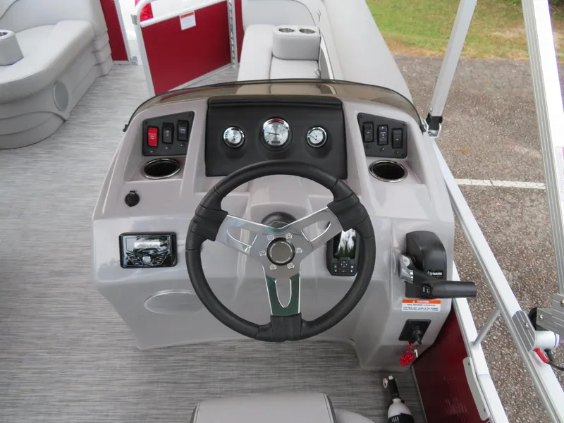 Slide: The Image of 2021 Bennington 20SLV boat dashboard with steering wheel and controls. - 8