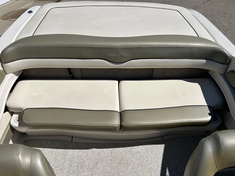 Slide: The Image of 2005 Sea Ray 200SP boat seating area with beige upholstery. - 19