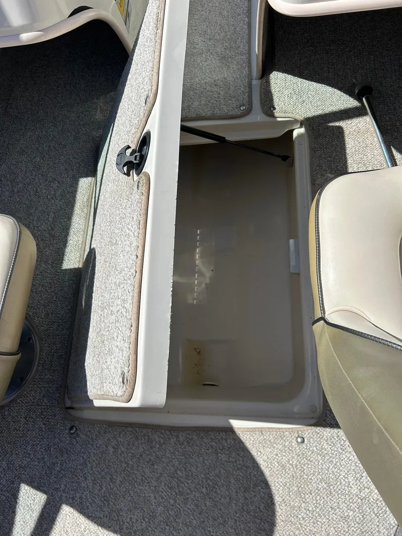 Slide: The Image of Open storage compartment in 2005 Sea Ray 200SP boat interior. - 23