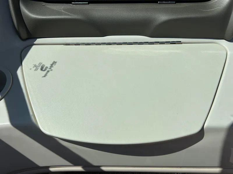 Slide: The Image of Dashboard of a 2005 Sea Ray 200SP boat, featuring a closed compartment. - 27