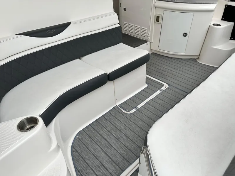 Slide: The Image of Interior seating of 2005 Regal 4260 COMMODORE yacht with gray and white upholstery. - 10