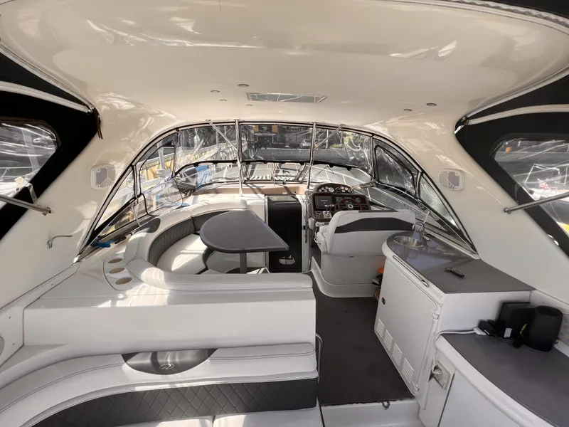 Slide: The Image of Interior of 2005 Regal 4260 Commodore yacht with seating and helm. - 12