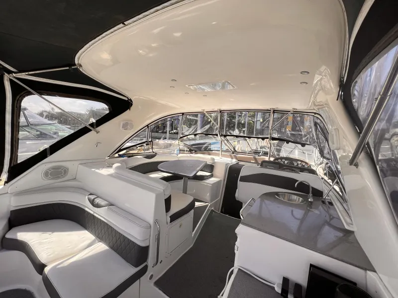 Slide: The Image of Luxurious interior of 2005 Regal 4260 Commodore yacht with elegant seating and modern amenities. - 13