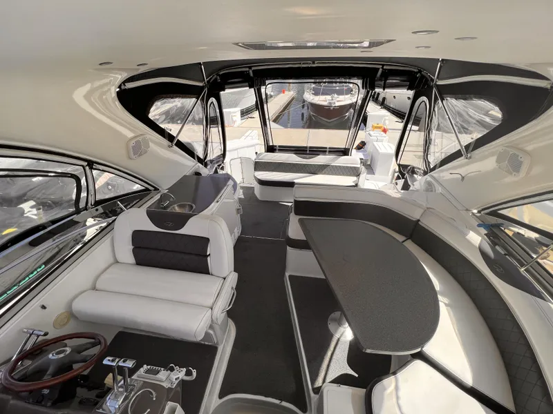 Slide: The Image of Luxurious interior of 2005 Regal 4260 Commodore yacht with elegant seating and helm. - 18