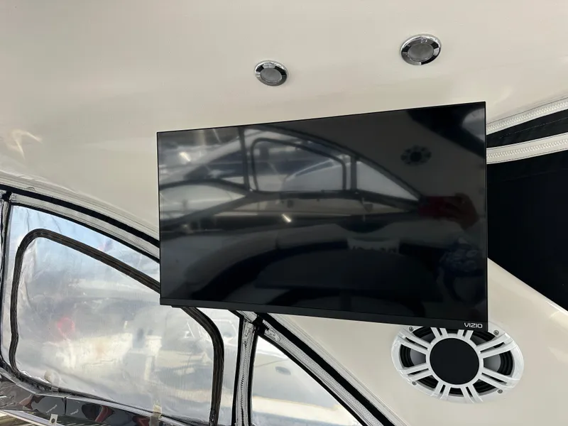 Slide: The Image of Flat-screen TV inside 2005 Regal 4260 Commodore yacht cabin with speaker and window view. - 20