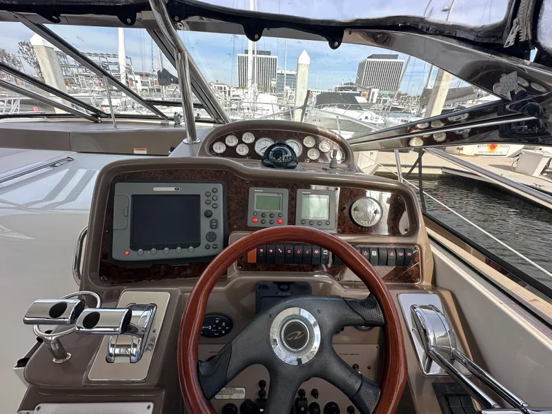 Slide: The Image of Cockpit view of 2005 Regal 4260 COMMODORE yacht with navigation instruments and steering wheel. - 25